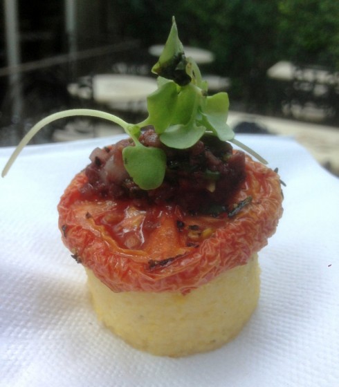 Branzino, polenta cakes with tomato and olive tapenade