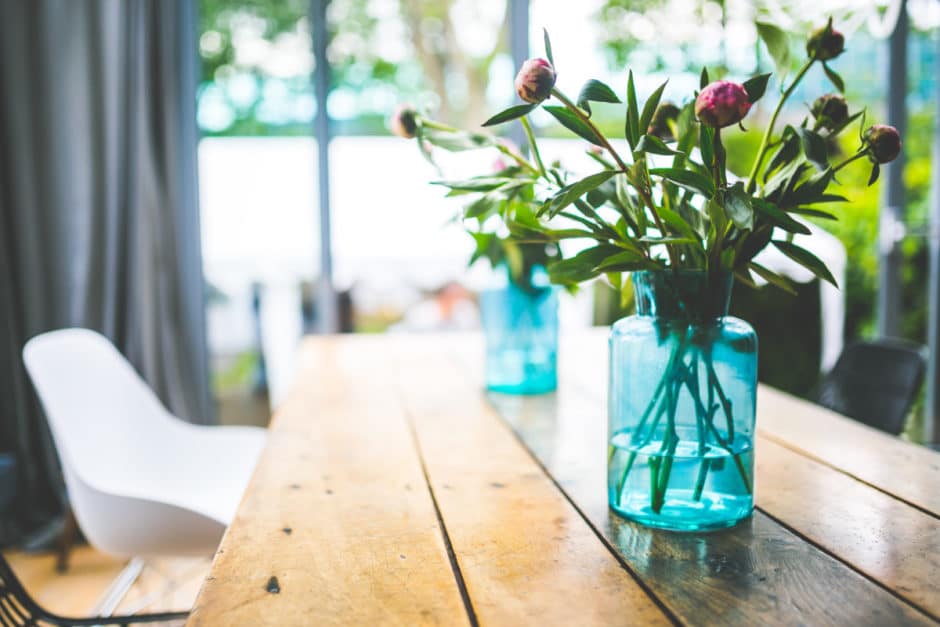 Peonies in a glass blue jar