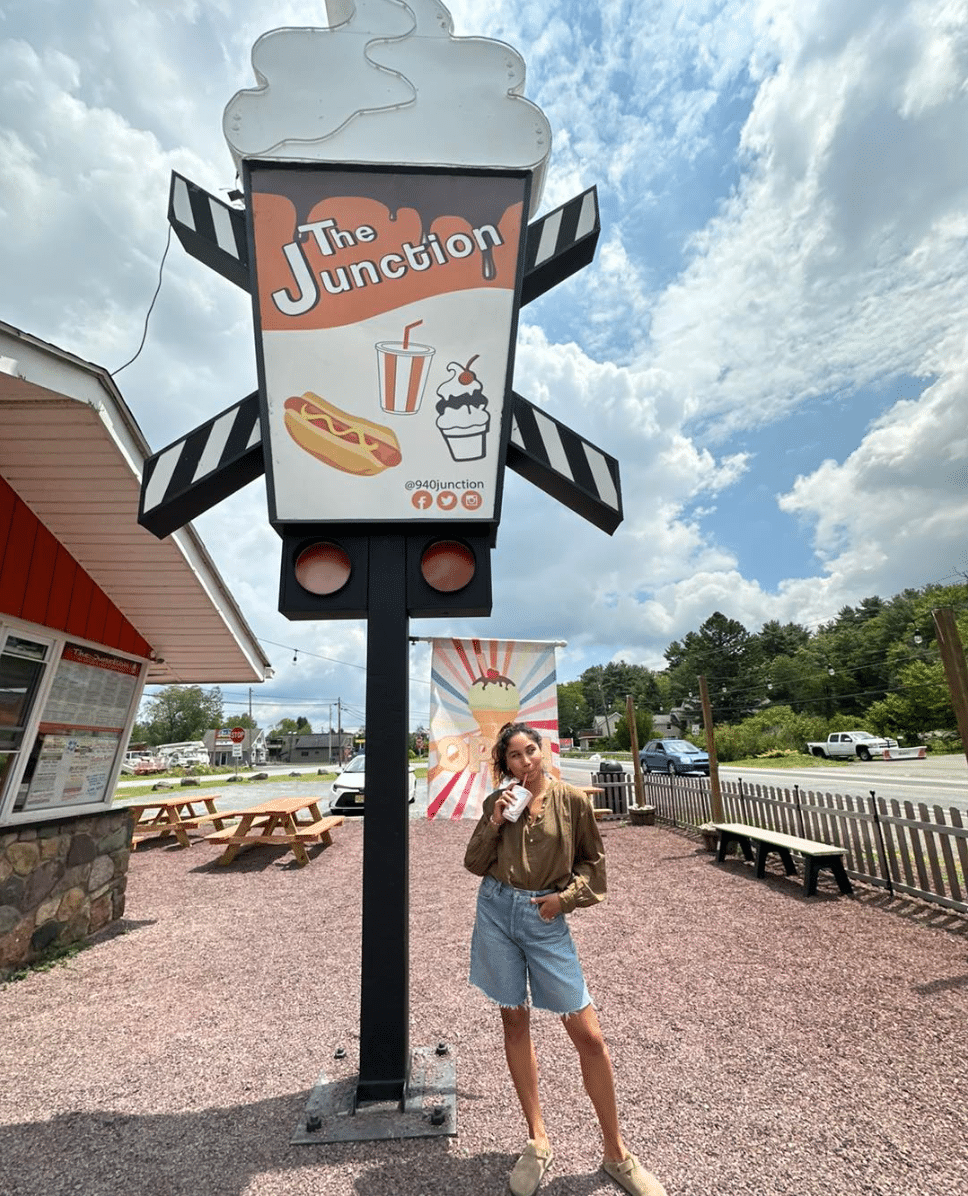 A woman holding a milkshake at 940 Junction. 