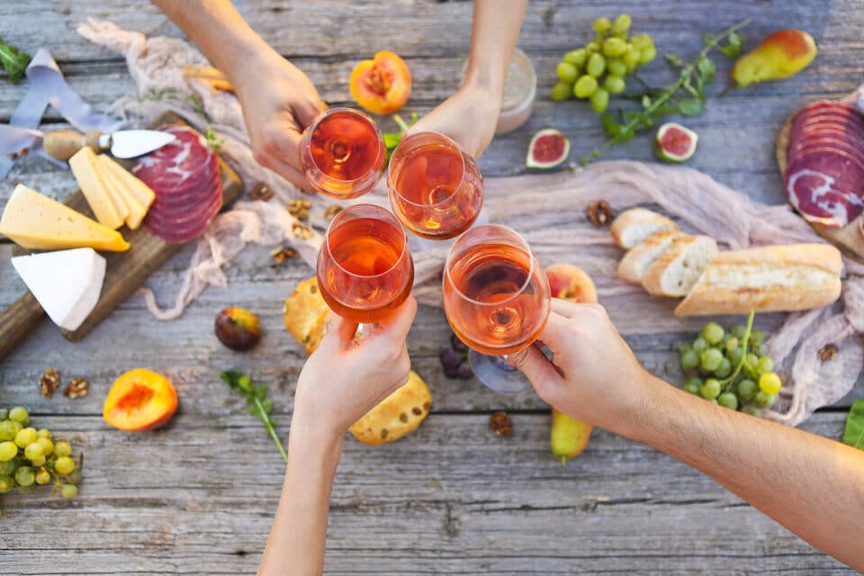 Rosé wine cheers at a picnic.