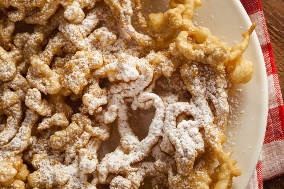 Homemade Funnel Cake with Powdered Sugar at the Fair.