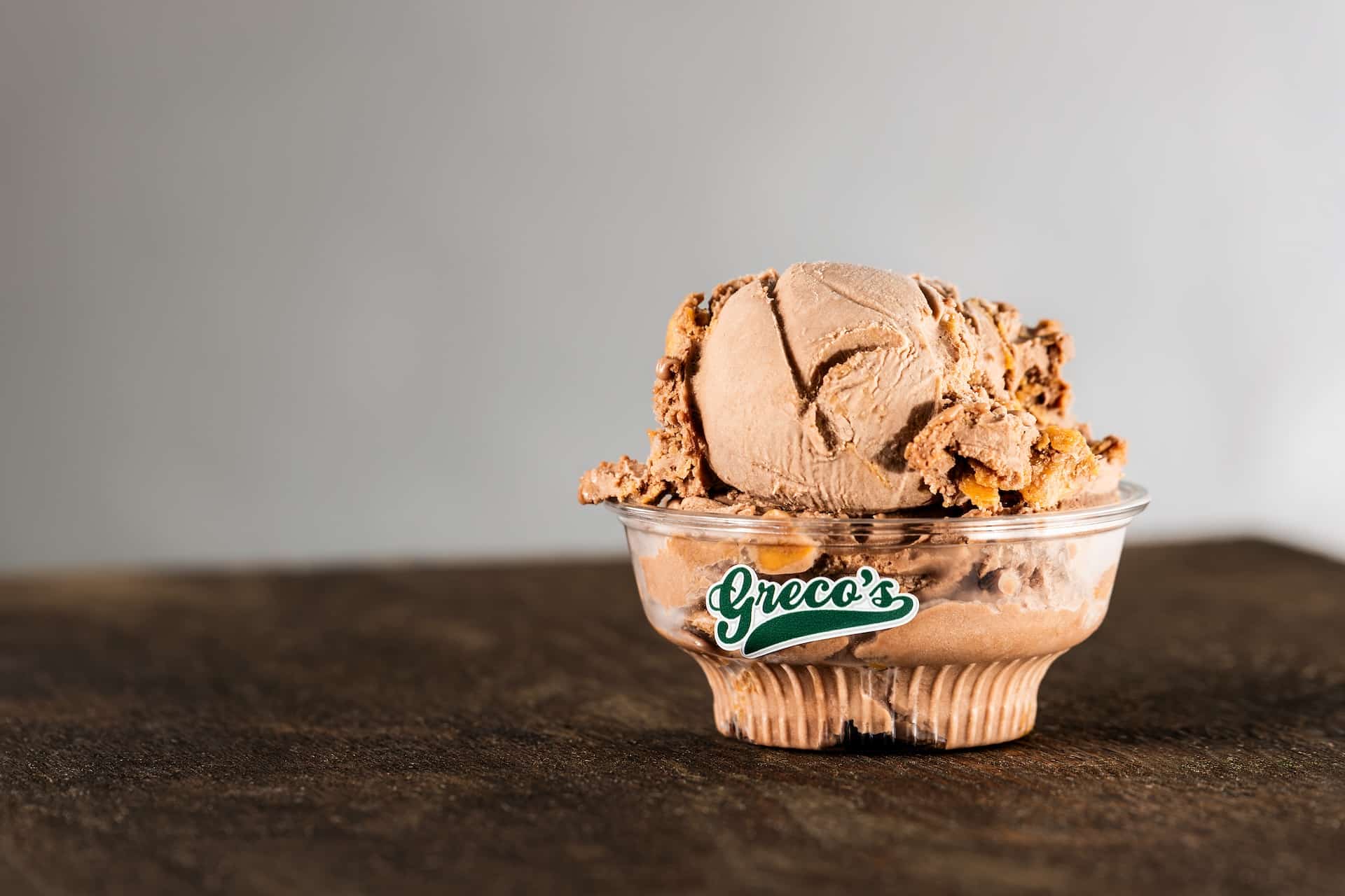 Greco's Italian Ice and Homemade Ice Cream scoop in a bow.