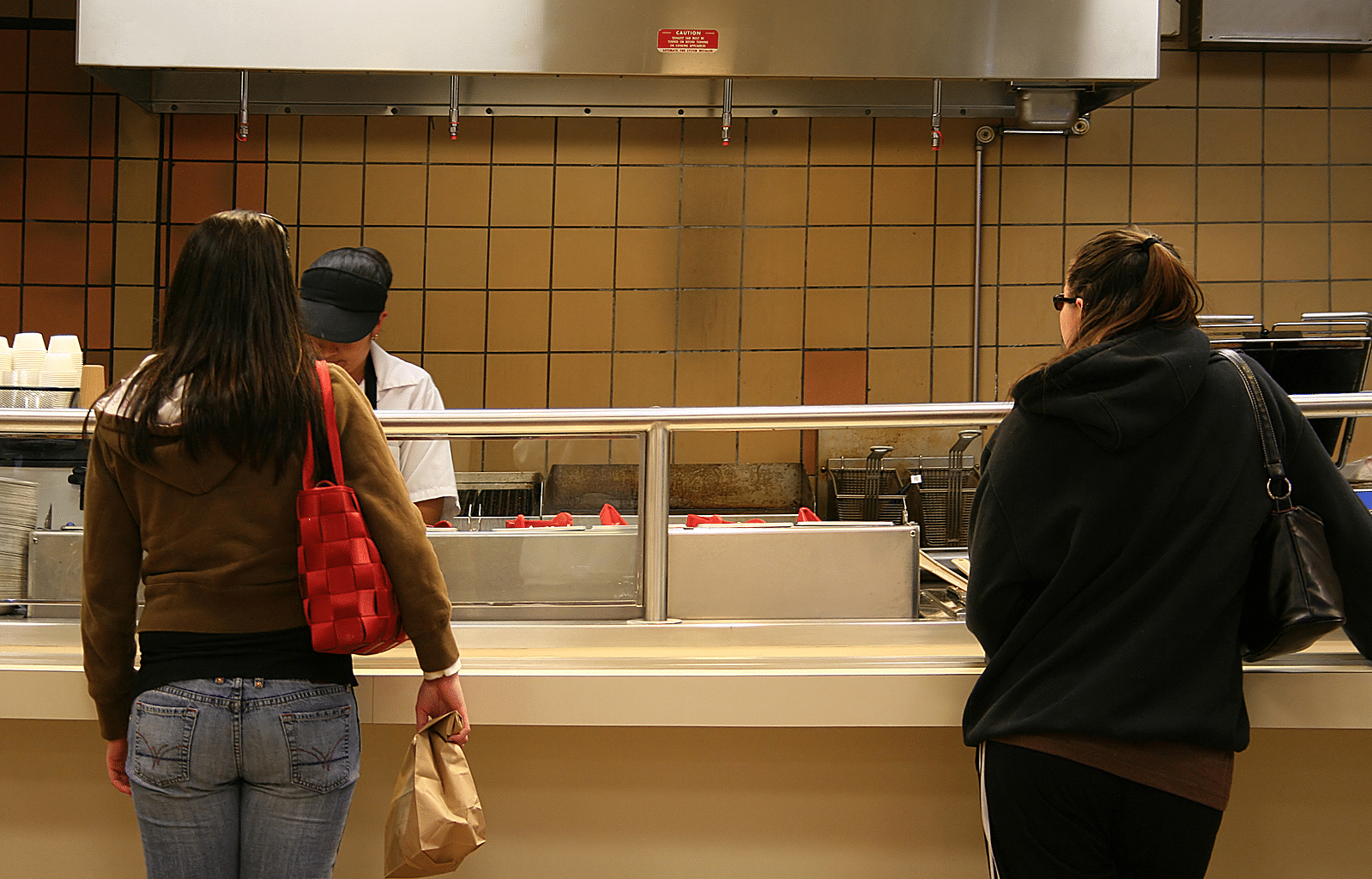 Girls in line at a cafeteria.