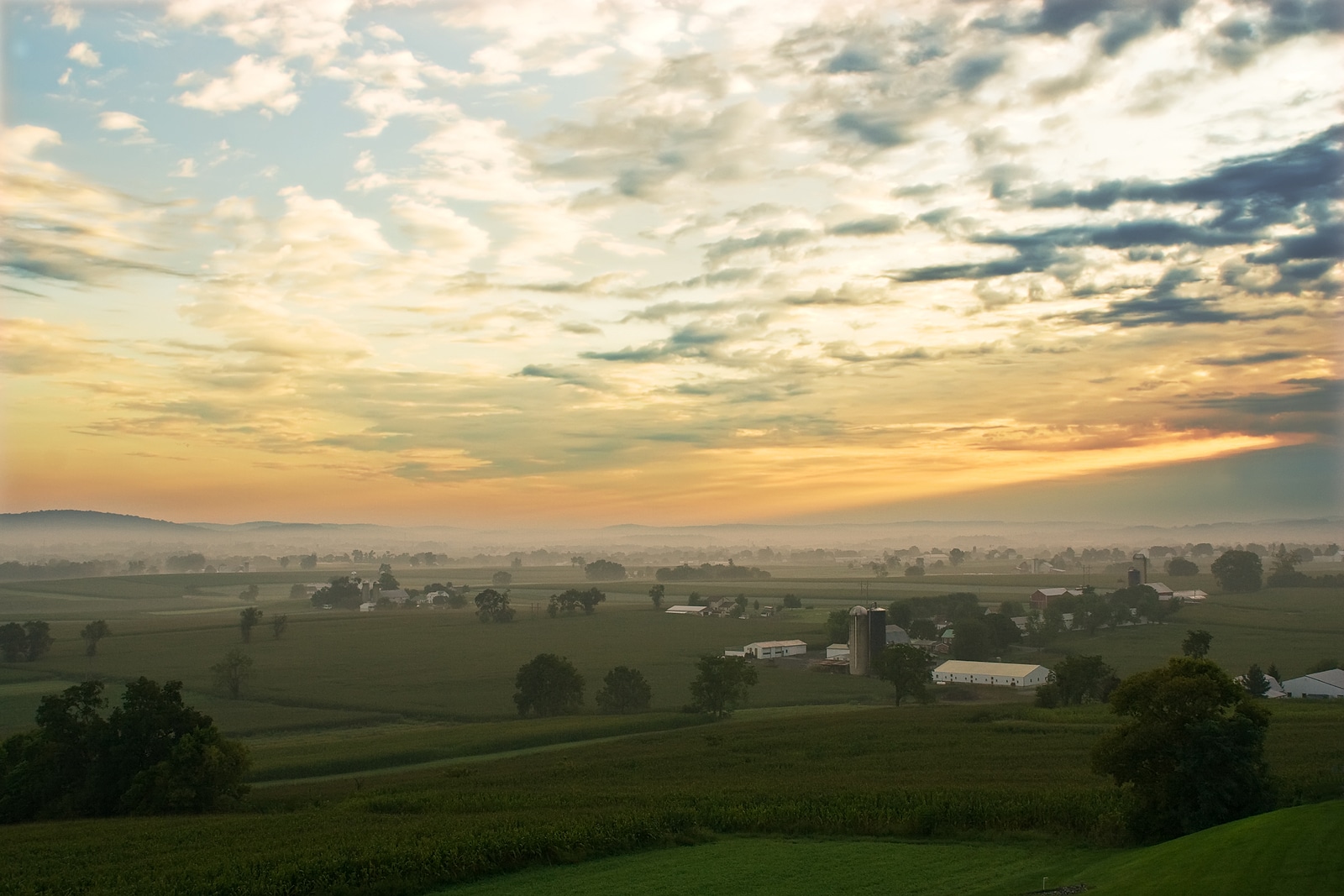 Sunrise over a foggy valley in Lancaster County, Pennsylvania.