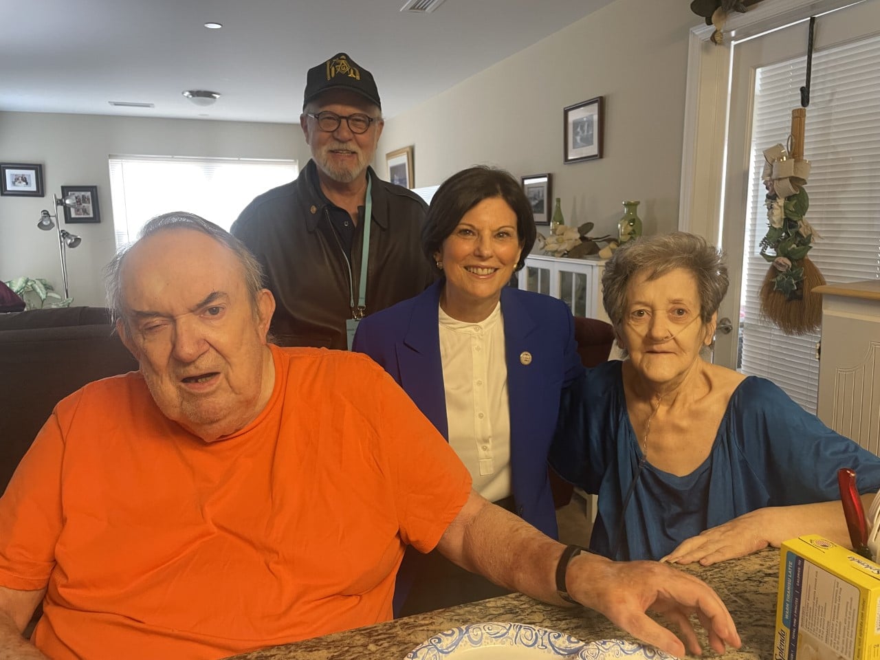 Client William Jones, volunteer and Board member Alan Czako, Commissioner Marian Moskowitz and Mrs. Mary Jones.