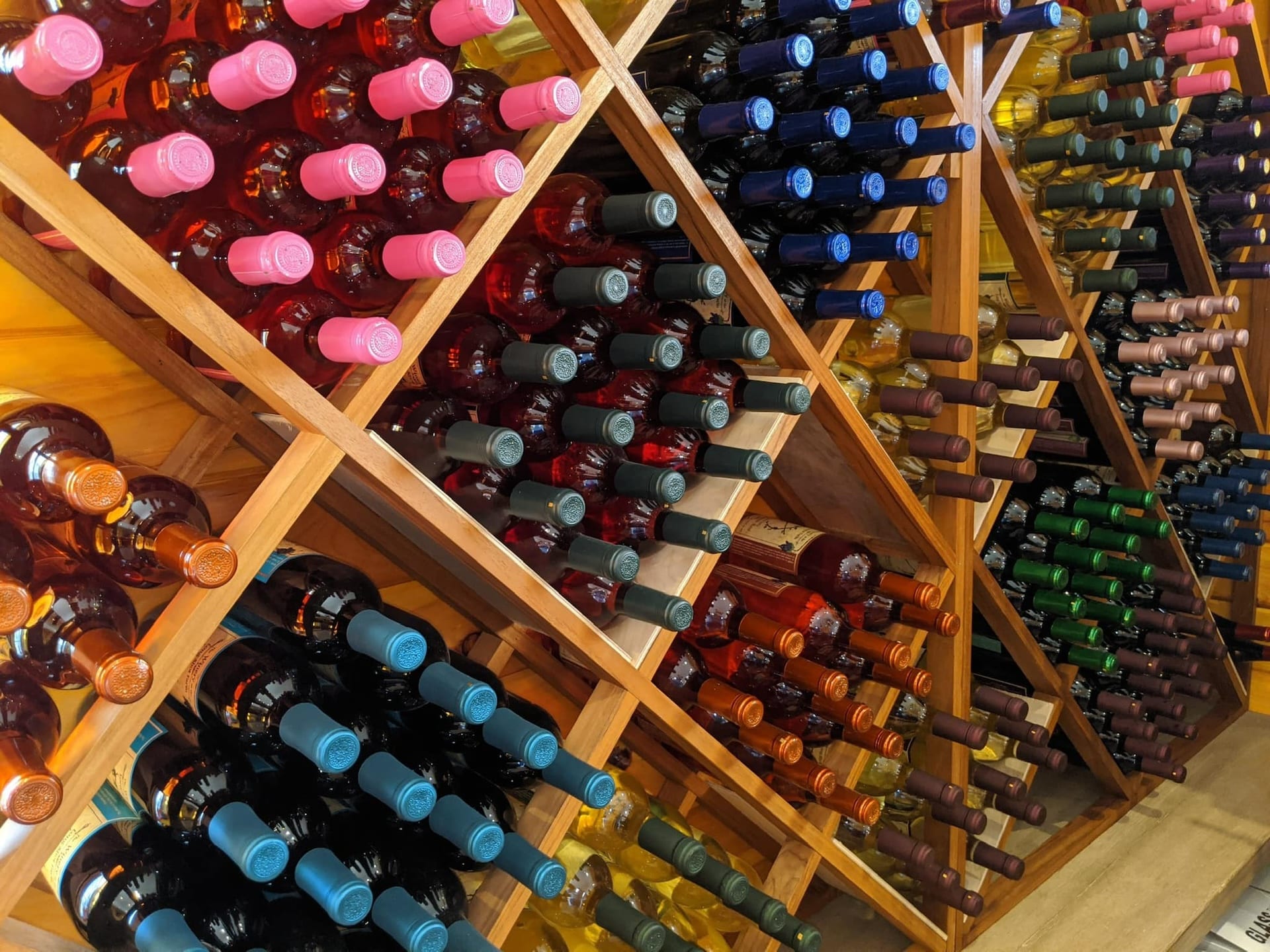 The Winery at the Long Shot Farm wine bottles on racks.
