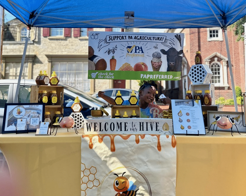 Herb Fuzion Handcrafted Honey vendor table.