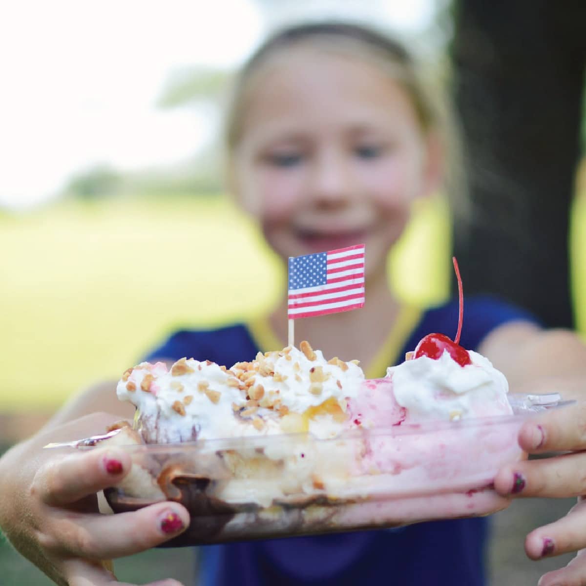 A young girl holds a banana split in Latrobe.