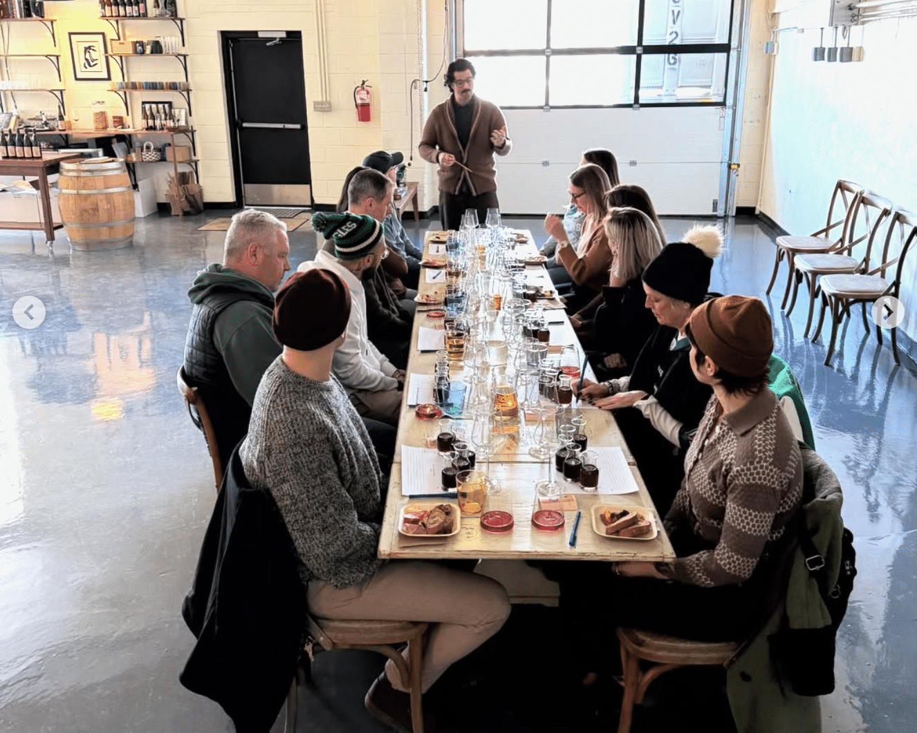 Caruso leads a wine tasting at Pray Tell Wines.