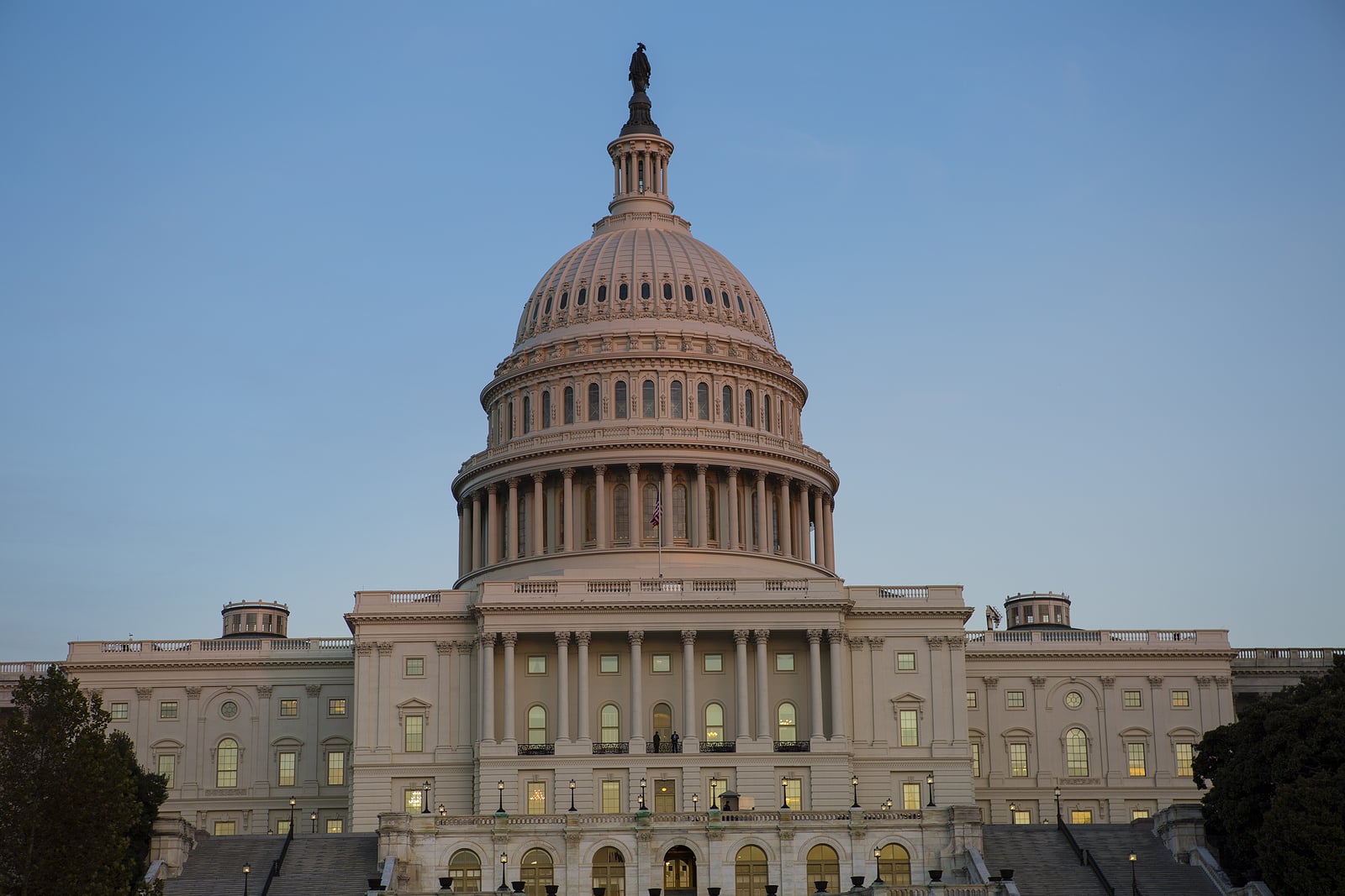 US Congress US Congress at dusk with flag waving.