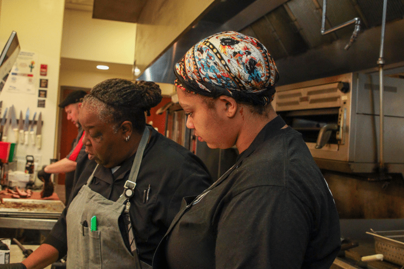 Chef Cory working with Caress at Community Kitchen PGH