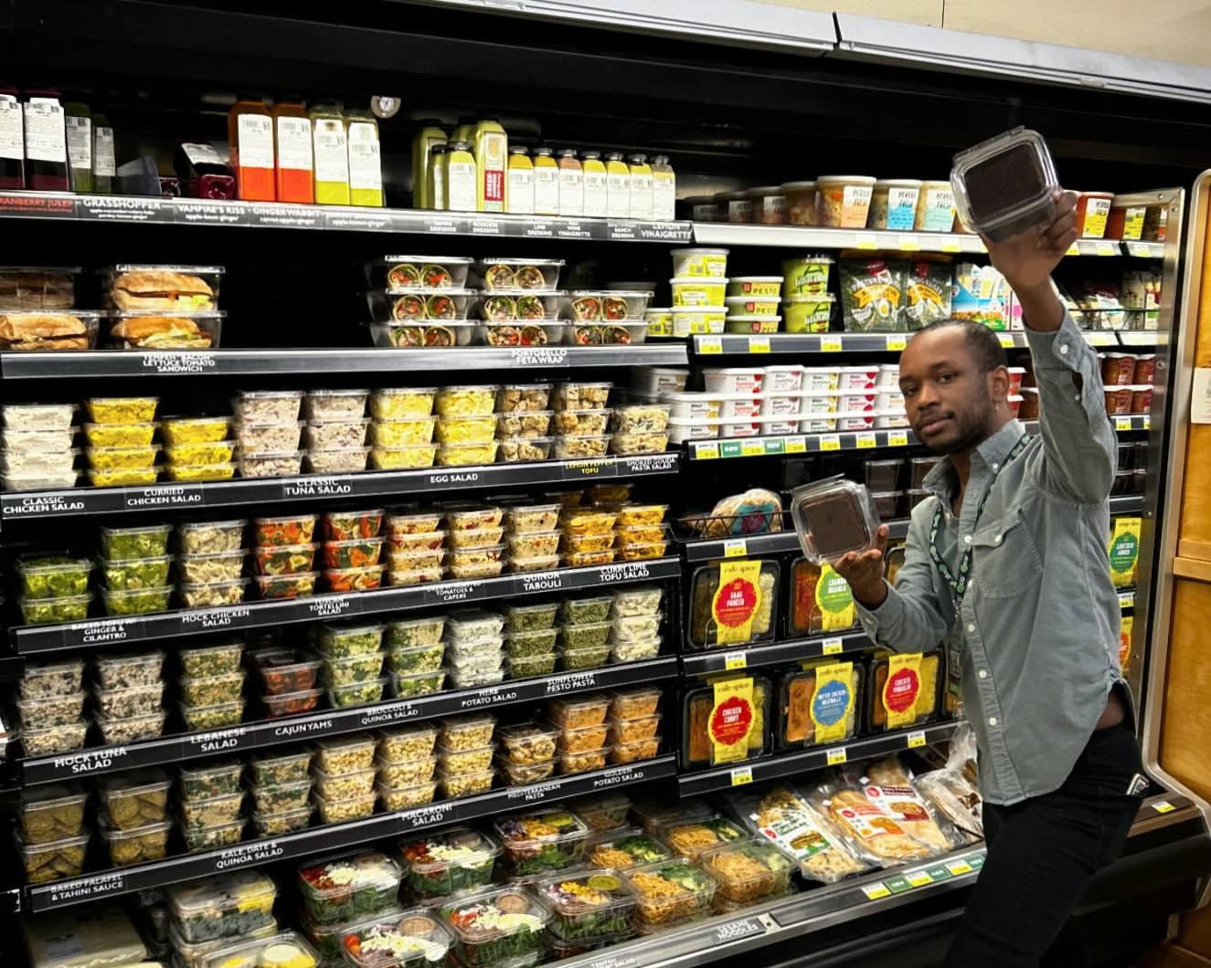 A shopper in the East End Food Co-op grab and go section.